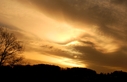 Sonnenaufgang_hinter_Wolken.jpg